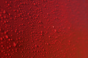 Droplets pattern on red backdrop. Juice splash. Red juicy surface drops, great design for any purposes. Texture background, pattern. Summer bright background. Bright sweet color.