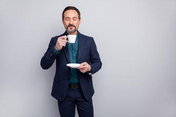 Photo of attractive business mature man elegant look manager boss drinking morning coffee smell nice aroma formalwear shirt pants blazer blue suit isolated grey color background