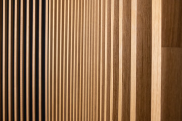 Obraz premium Wall decorated with wooden planks. Futuristic geometric wall design. Wood texture.