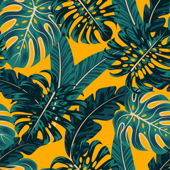 Fashionable seamless tropical pattern with colorful plants and leaves on a yellow background. Beautiful print with hand drawn exotic plants. Exotic jungle wallpaper. Hawaiian style.