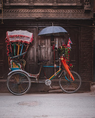 Colorful traditional rickshaws parked in the streets of Thamel district in Kathmandu city, Nepal