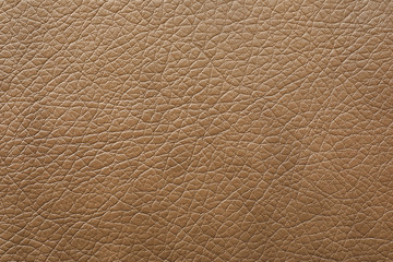 Texture of light brown leather as background, closeup