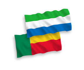 National vector fabric wave flags of Benin and Sierra Leone isolated on white background. 1 to 2 proportion.