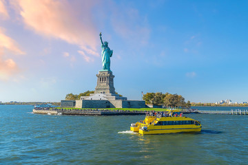The Statue of Liberty with Manhattan city skyline background