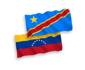National vector fabric wave flags of Venezuela and Democratic Republic of the Congo isolated on white background. 1 to 2 proportion.
