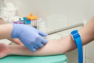 Blood test from vein in clinic closeup