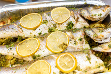 Whole roasted sea bass. Oven baked whole fish with lemon, herbs and thyme.