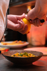 Chef pilling lemon zest