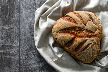 Fresh homemade buckwheat bread. healthy sourdough bread. Dark background with place for text.