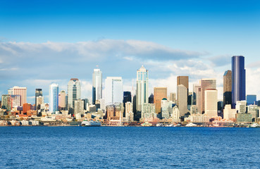 Fototapeta na wymiar Day panorama of Seattle busy downtown skyline over Elliot bay waters, Washington, USA