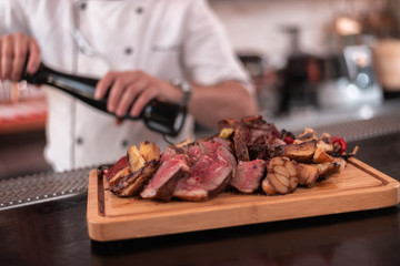 Grinding fresh pepper on a steak