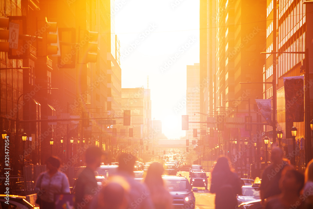 Wall mural crowd over sunset in downtown philadelphia sun lit street in the evening