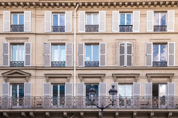 Paris, typical facade in the Marais, detail of the windows