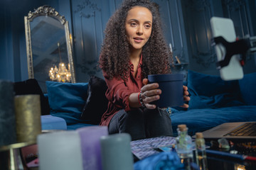 Young woman blogger talking to her fans