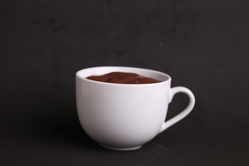 Obraz na płótnie Canvas white cup of delicious chocolate