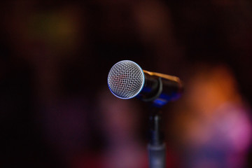 Vocal microphone on a stage at night