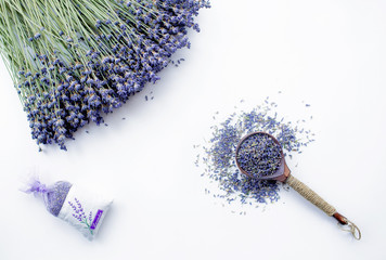 Lavender in a wooden spoon and a vintage bag on a white background. Invitation, spa, recipe...