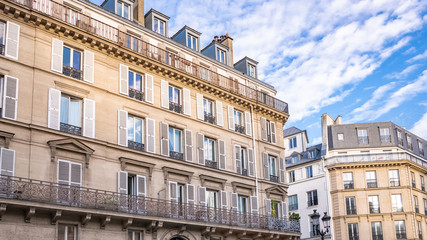Paris, typical facade and windows, beautiful buildings in the Marais