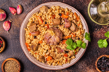 Pilaf with meat, vegetables and spices.