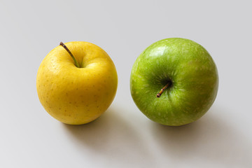Two ripe apples, yellow and green color