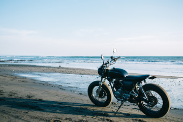 Modern motorbike parked at sunny beach © BullRun