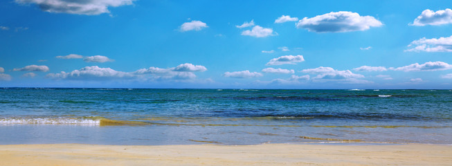 Caribbean sea and blue sky with clouds. Travel background.