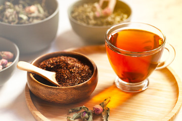 Composition with different kinds of tea: green, black and herbal tea, with fruit and flowers....