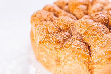 Close up of bread with sesame on table.