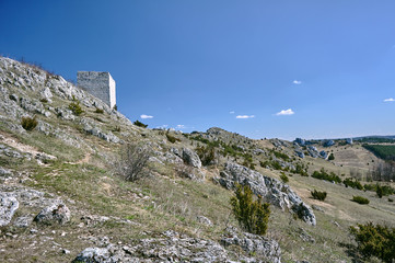 white rocks and ruined medieval castle in Olsztyn, Poland.