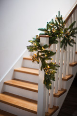 Fototapeta na wymiar Christmas decor at the wooden stairs indoor