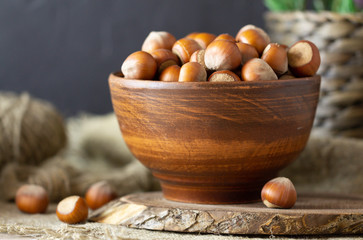 Hazelnuts in a clay plate. Country style. Natural food.
