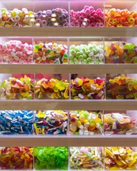 Rolgordijnen Sweets on display for pick and mix in candy shop © Robert Kneschke