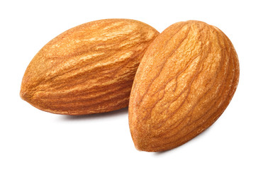 Close-up of two delicious almonds, isolated on white background