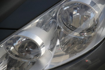 Classic car headlight during the day