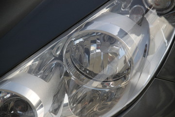 Classic car headlight during the day