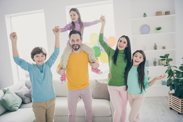 Full dream cozy comfort harmony people family enjoy anniversary event celebration hold hands mom mommy hug her three little children dad daddy piggyback scream couch in house room