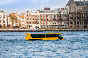 Obraz premium Attraction in Rotterdam, an amphibious vehicle in the river 