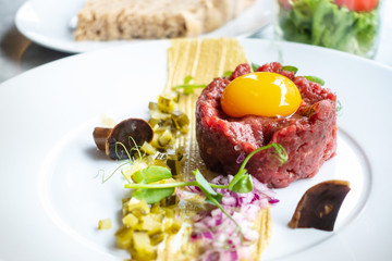 tasty Steak tartare (Raw beef) - classic steak tartare on white plate