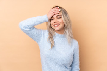 Teenager girl over isolated background laughing