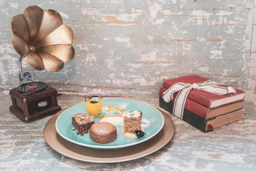Chocolate brownie, malva pudding, pumpkin spice cake with glazed frosting and lemon curd in a small...