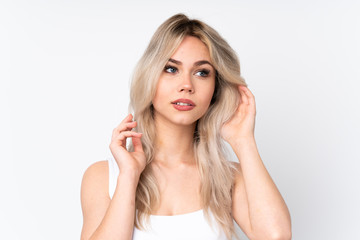 Fototapeta premium Teenager blonde girl over isolated white background . Portrait