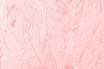 Texturized pink putty. Vintage background of venetian stucco texture. Monochrome abstract background. Close-up.