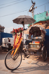 Fototapeta na wymiar Colorful traditional rickshaws parked in the streets of Thamel district in Kathmandu city, Nepal