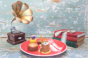 Chocolate brownie, malva pudding, pumpkin spice cake with glazed frosting and lemon curd in a small...