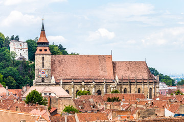 Beautiful view of Black Church, White Tower and Brasov old town in a spring day, Transylvania, Romania.
