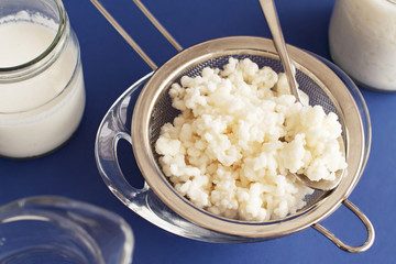 Fermented drink kefir in small bottles and kefir grains