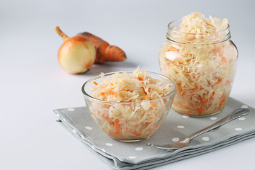 Fermented food, Homemade Sauerkraut with carrots in a bowl and jar on white background