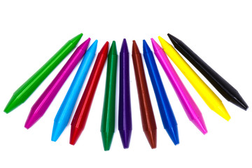 Colored wax pencils. A bunch on white background close-up