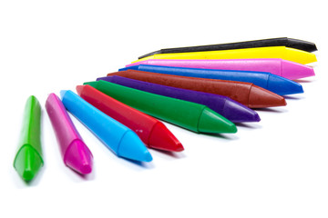 Colored wax pencils. A bunch on white background close-up