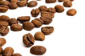 Coffee. roasted coffee beans on white background  in close-up